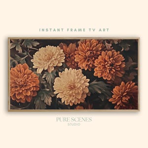 May include: A rectangular digital artwork titled INSTANT FRAME TV ART by PURE SCENES STUDIO, featuring a dark background with clusters of blooming chrysanthemum flowers in shades of cream, light orange, and deep burnt orange with green foliage.