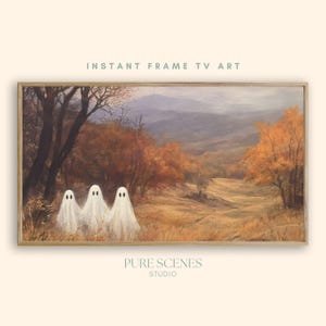 May include: A rectangular framed digital artwork titled INSTANT FRAME TV ART by PURE SCENES STUDIO. The image depicts a landscape with three white sheet ghosts in a field of golden autumn trees and mountains under a soft, overcast sky.