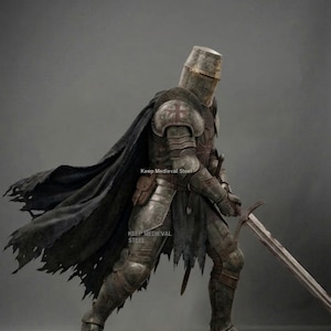 May include: A full suit of medieval armor, including a helmet, chest plate, and leg guards. The armor is a weathered silver color, with a black cape and a sword. The text "Keep Medieval Steel" is visible.