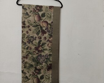 Extra long two sided table runner.Tapestry ,one side fruits and on the other stripped. 66" long,15"wide.