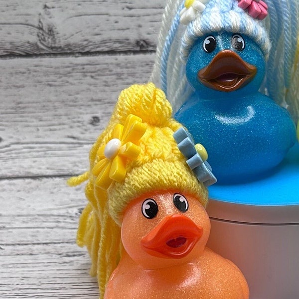 Adorable rubber ducks with ponytail and flowers on top, ducks, rubber ducks