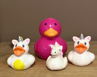 Rubber duck bundle, one 3X3 plastic duck with one unicorn duck inside and 3 - approx 2 in rubber ducks for ducking, party favors, cruising