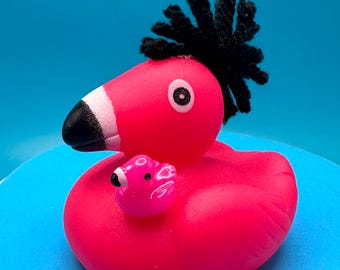 Flamingo, rubber flamingo with Mohawk  and baby or two plain flamingos. Your choice, the Mohawk flamingo is made of yarn and one of a kind