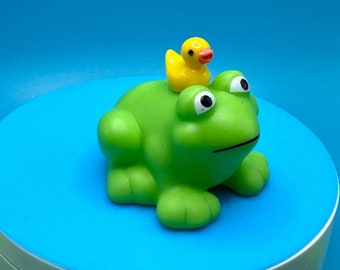 rubber frogs with duck friend along for the ride, rubber ducks, go ducking,