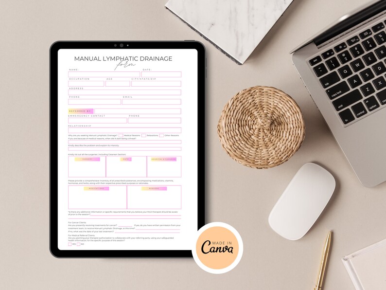 May include: A digital form titled "Manual Lymphatic Drainage Form" with fields for name, occupation, age, date, and other information. The form is on a tablet computer and is surrounded by a white surface, a laptop computer, a woven coaster, a white mouse, and a gold pen.