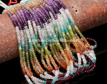 May include: A strand of colorful gemstone beads, including amethyst, aquamarine, peridot, citrine, and garnet. The beads are faceted and have a smooth, polished finish.