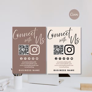 Puede incluir: Dos letreros comerciales rectangulares con el texto Connect with Us en fuente cursiva, un código QR, un icono de Instagram y una fila de iconos de redes sociales. El letrero izquierdo es malva con texto blanco, el derecho es crema con texto negro.