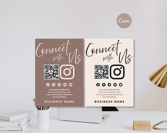 Puede incluir: Dos letreros comerciales rectangulares con el texto Connect with Us en fuente cursiva, un código QR, un icono de Instagram y una fila de iconos de redes sociales. El letrero izquierdo es malva con texto blanco, el derecho es crema con texto negro.