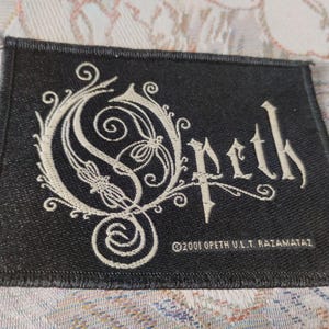 Opeth, progressive death metal band, vintage 2001 sew on patch logo, official merchandising, used very good condiction vintage. Extra rare