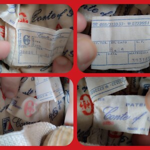 May include: Close-up of a white fabric label with the text "Conte of" printed in black. The label is attached to a white fabric item with a red and white pattern. The label also has the text "Made in Italy" printed on it.
