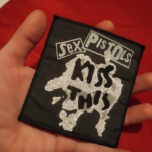 Sex Pistols, kiss this sy-på lapp vintage 90-tal, begagnade silvereffekter, bäst från 1992, fantastisk punklapp för fantastisk punkrockjacka väst stu