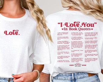 May include: White t-shirt with the word "Love." in red on the front and the text "I Love You" in book quotes on the back. The back of the shirt also has a red heart and a red playing card symbol.