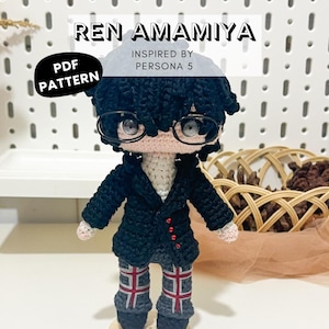 May include: A handmade crochet doll of Ren Amamiya, inspired by Persona 5. The doll features black hair, glasses, a black jacket, and patterned pants. The text "REN AMAMIYA" and "PDF PATTERN" are visible.