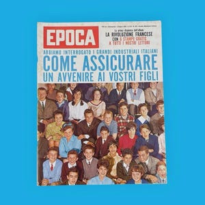 May include: A vintage magazine cover with the title "EPOCA" in red. The cover features a group of people and text in Italian, including "COME ASSICURARE UN AVVENIRE AI VOSTRI FIGLI."