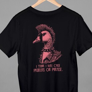 May include: Black t-shirt with a pink illustration of a punk rock goose with a mohawk and the text "I think I will cause problems on purpose."