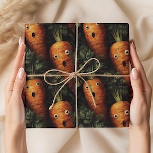 May include: Gift wrap featuring a repeating pattern of surprised-looking cartoon carrots with green tops. The carrots are orange with wide eyes and open mouths. The gift is tied with twine.