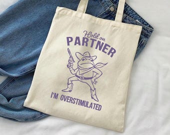 Hold On Partner Im Overstimulated Tote Bag, Vintage Cowboy Frog Tote Bag, Western Frog Unhinged Tote Bag, Retro Animal Tote Bag, Gag Gifts