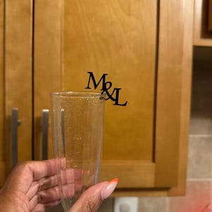 "Elegant champagne glass decor tags, personalized for weddings or celebrations."
