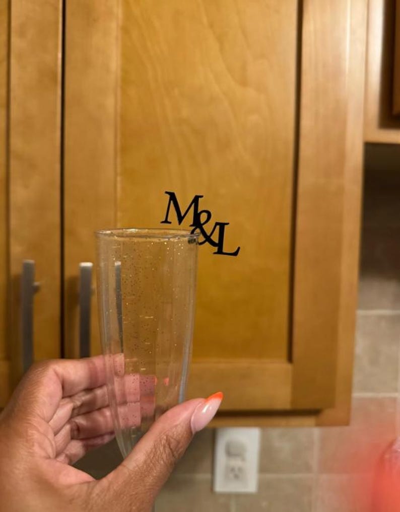 "Elegant champagne glass decor tags, personalized for weddings or celebrations."