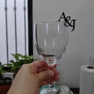 "Customizable drink toppers for weddings, personalized wine glass tags in sets."