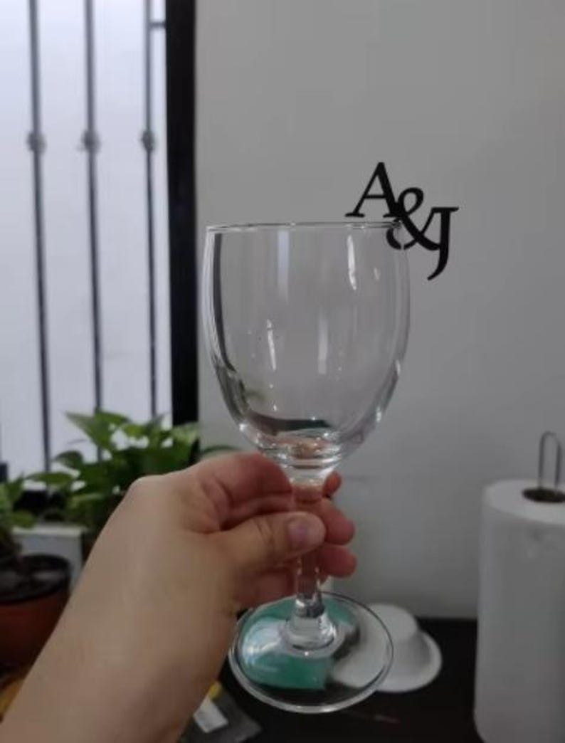 "Customizable drink toppers for weddings, personalized wine glass tags in sets."