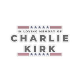 May include: A sticker featuring the text "IN LOVING MEMORY OF CHARLIE KIRK". The text is in grey with a white border. The design incorporates red and blue stripes and stars, giving a patriotic feel.