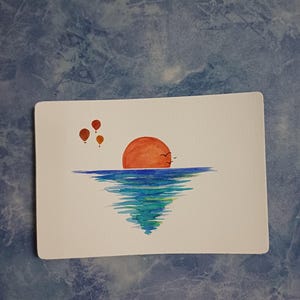 Carte coucher de soleil avec des montgolfières