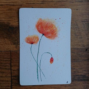 Carte fleurs rouges et dorées