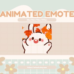 May include: An animated emote featuring a white bunny with autumn leaves in its ears and on its head. The bunny has a happy expression and is waving. The text "ANIMATED EMOTE" is at the top of the image.