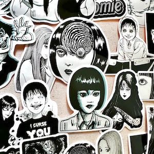 May include: A collection of black and white horror-themed stickers featuring characters with spiral eyes, a girl with a knife, and a boy with the text "I curse you".