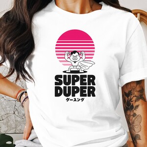 Camiseta retro de superhéroe con atardecer, divertida camiseta con dibujos animados, estilo vintage, texto japonés genial, diseño de héroe único.