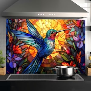 May include: A stained glass style kitchen backsplash featuring a colorful hummingbird in flight against a yellow sun and floral background.