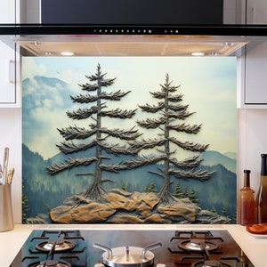 May include: A kitchen backsplash with a scenic image of two pine trees on a mountaintop. The trees are silhouetted against a blue sky with white clouds. The backsplash is installed above a black gas stovetop.