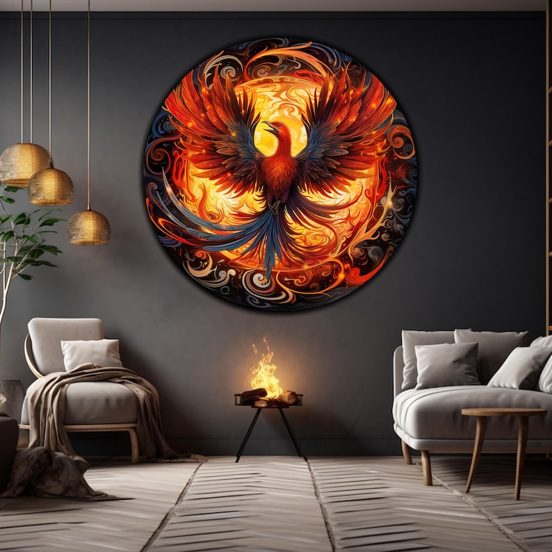 May include: A circular wall art piece featuring a fiery phoenix with red, orange, and yellow flames against a black background. The phoenix has blue and black feathers and is surrounded by swirling patterns.