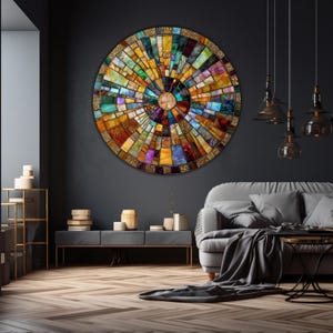 May include: A large circular wall art piece made of colorful mosaic tiles. The tiles are arranged in a radial pattern, creating a sunburst effect. The center of the piece is a smaller circle of gold tiles.