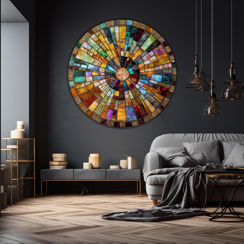 May include: A large circular wall art piece made of colorful mosaic tiles. The tiles are arranged in a radial pattern, creating a sunburst effect. The center of the piece is a smaller circle of gold tiles.