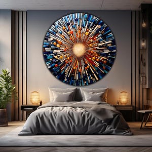 May include: A large, round, abstract wall art piece with a burst of color in the center. The artwork is made of various shades of blue, orange, and yellow, and has a textured, mosaic-like appearance.