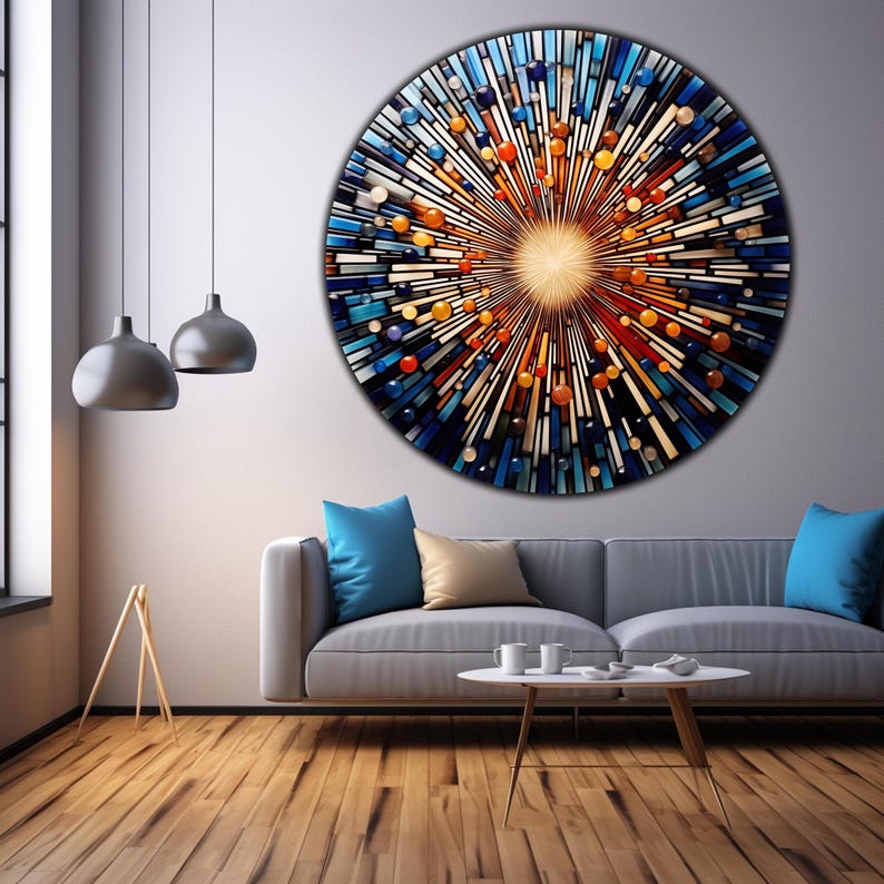May include: A large circular wall art piece with a burst of colorful glass tiles in shades of blue, orange, and yellow. The tiles are arranged in a radial pattern, creating a sense of movement and energy.
