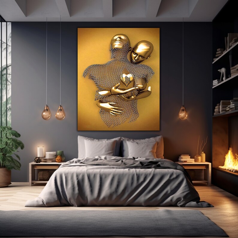 May include: A gold-toned sculpture of two figures embracing, with a heart shape in the center of their chests. The sculpture is set against a yellow background.