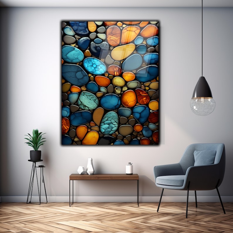 May include: Abstract art print featuring a colorful pattern of blue, green, orange, and brown rounded shapes resembling stones or pebbles.