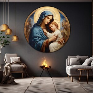 May include: A round painting of the Virgin Mary holding a baby Jesus. The painting is set against a dark blue background with gold accents. The Virgin Mary is wearing a blue robe and a gold crown. The baby Jesus is wearing a white robe.