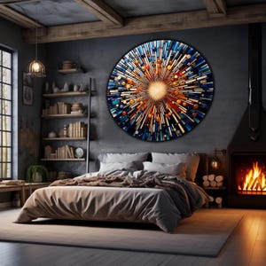 May include: A modern bedroom with a large circular stained glass wall art piece featuring a burst of colors, including blue, orange, and yellow. The art piece is centered on a gray wall above a bed with a brown comforter and white pillows. The room has a fireplace and a wooden shelf with books.