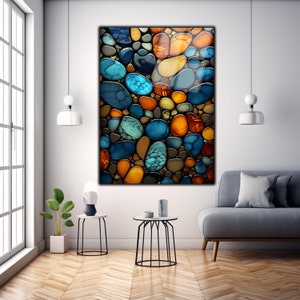 May include: Abstract art print featuring a colorful mosaic of round shapes in shades of blue, green, orange, and brown. The shapes resemble stones or pebbles.