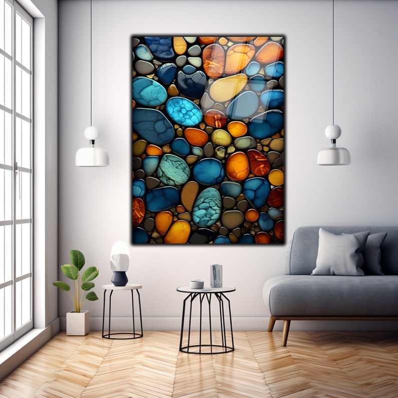 May include: Abstract art print featuring a colorful mosaic of round shapes in shades of blue, green, orange, and brown. The shapes resemble stones or pebbles.