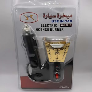 May include: A black electric car incense burner with a gold-colored metal incense holder. The packaging says "Use in Car" and "Electric Incense Burner".