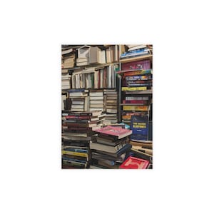 May include: A collection of books stacked on top of each other, creating a wall of literature. The spines of the books are visible, displaying a variety of colors and titles. Some books are stacked neatly, while others are haphazardly placed.