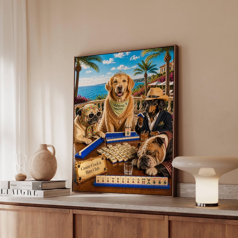 May include: A framed art print depicts dogs playing mahjong in a tropical setting. A golden retriever wears a bandana that says "Mahjong Maven." Other dogs wear sunglasses and hats. The text "Canine Crack & Bam Club" is visible.