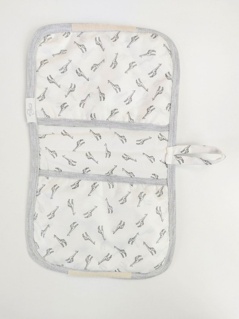 BABY Soft Pocketed Changing Mat for Effortless Diaper Changes. It can be folded into a bag and carried easily. image 8