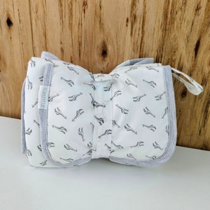 BABY Soft Pocketed Changing Mat for Effortless Diaper Changes. It can be folded into a bag and carried easily. image 2