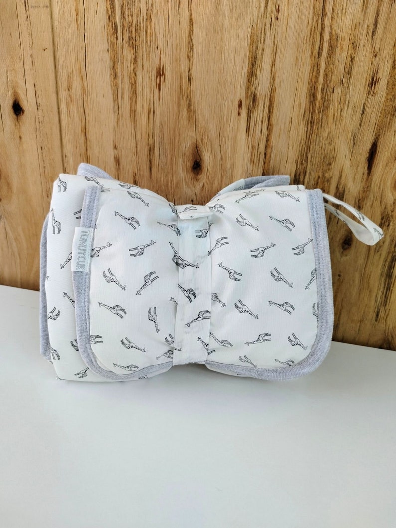 BABY Soft Pocketed Changing Mat for Effortless Diaper Changes. It can be folded into a bag and carried easily. image 2